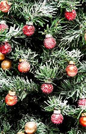round ornament hanging of a tree - Christmas Tree with decorations Stock Photo - Budget Royalty-Free & Subscription, Code: 400-04153809