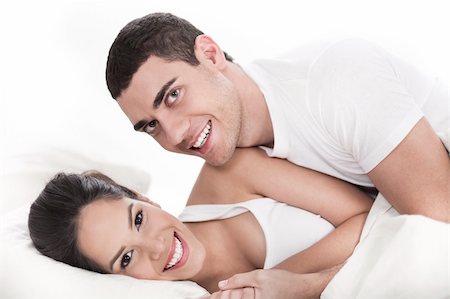 Young couple having fun in bed over white background Stock Photo - Budget Royalty-Free & Subscription, Code: 400-04165087
