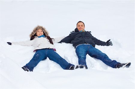 Young couple playing outdoors in the snow. Stock Photo - Budget Royalty-Free & Subscription, Code: 400-04166907