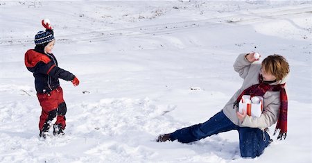 snowball fight child - Happy people playing in the snow of winter Stock Photo - Budget Royalty-Free & Subscription, Code: 400-04167055