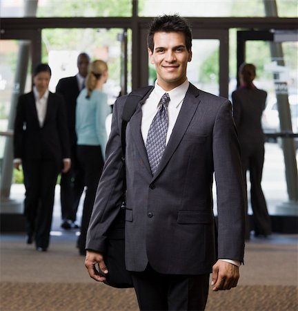 simsearch:400-04167547,k - Young businessman smiling.  Square framed shot. Stock Photo - Budget Royalty-Free & Subscription, Code: 400-04167456