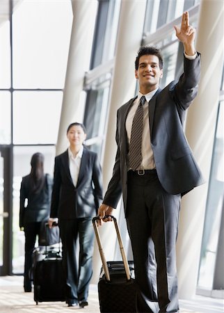 simsearch:400-04167547,k - Young businessman with luggage.  Vertically framed shot. Stock Photo - Budget Royalty-Free & Subscription, Code: 400-04167493