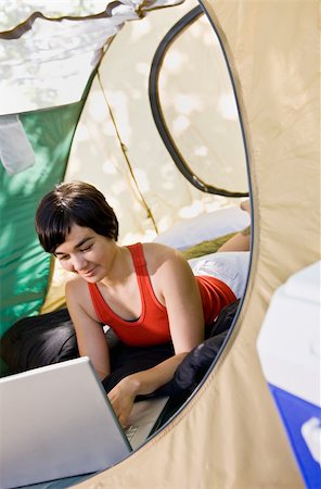 simsearch:400-04168729,k - Woman using laptop in tent Stock Photo - Budget Royalty-Free & Subscription, Code: 400-04167735