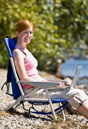 simsearch:400-04168729,k - Woman using laptop near stream Stock Photo - Budget Royalty-Free & Subscription, Code: 400-04167789