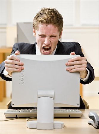 scream computer mad - Businessman shouting at computer Stock Photo - Budget Royalty-Free & Subscription, Code: 400-04167811