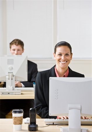 simsearch:400-04129016,k - Business people typing on computers Stock Photo - Budget Royalty-Free & Subscription, Code: 400-04167859