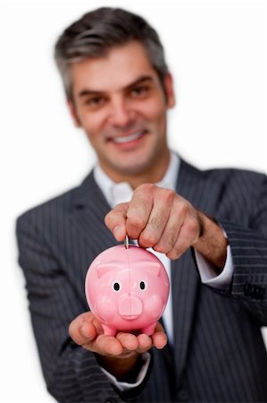 simsearch:400-05715051,k - Businessman saving money in a piggybank isolated on a white background Fotografie stock - Microstock e Abbonamento, Codice: 400-04168025