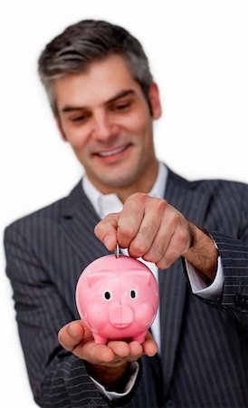 simsearch:400-05715051,k - Confident businessman saving money in a piggybank against a white background Fotografie stock - Microstock e Abbonamento, Codice: 400-04168028