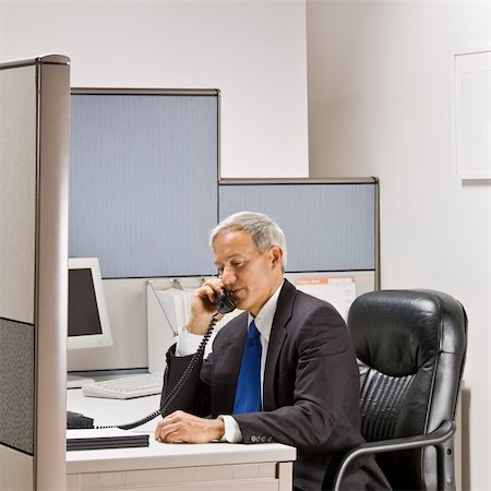 simsearch:400-04129016,k - Businessman talking on telephone at desk Stock Photo - Budget Royalty-Free & Subscription, Code: 400-04168401