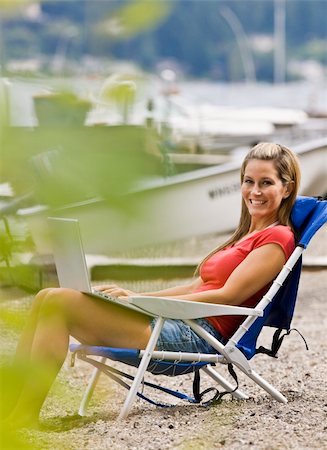 simsearch:400-04168729,k - Woman using laptop on beach Stock Photo - Budget Royalty-Free & Subscription, Code: 400-04168562