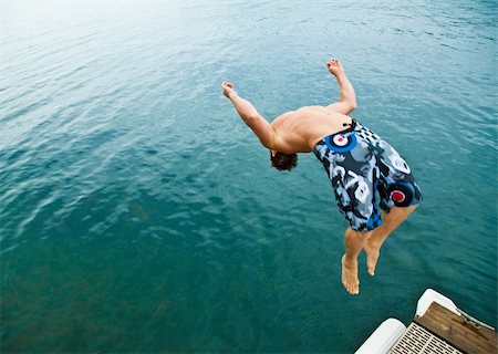 Man doing back-flip into lake Stock Photo - Budget Royalty-Free & Subscription, Code: 400-04168572