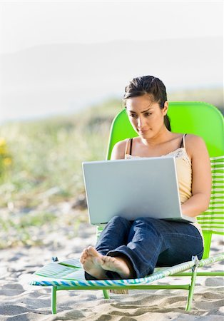 simsearch:400-04168729,k - Woman using laptop at beach Stock Photo - Budget Royalty-Free & Subscription, Code: 400-04168725