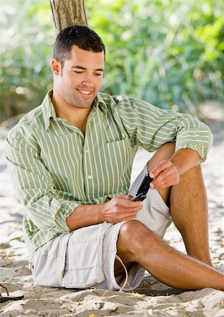 simsearch:400-04168729,k - Man text messaging on cell phone at beach Stock Photo - Budget Royalty-Free & Subscription, Code: 400-04168721