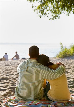 simsearch:400-04168729,k - Couple hugging at beach Stock Photo - Budget Royalty-Free & Subscription, Code: 400-04168737
