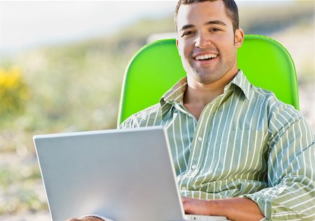 simsearch:400-04168729,k - Man using laptop at beach Stock Photo - Budget Royalty-Free & Subscription, Code: 400-04168730