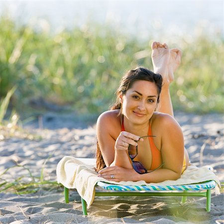 simsearch:400-04168729,k - Woman laying on lounge chair at beach Stock Photo - Budget Royalty-Free & Subscription, Code: 400-04168743