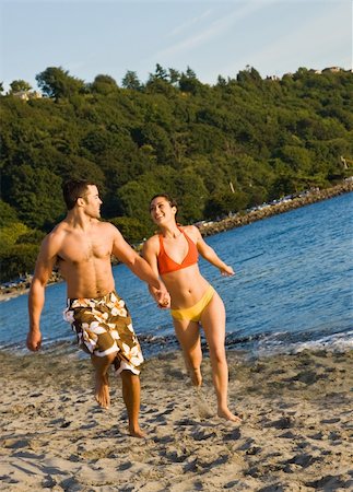 people rushing beach - Couple running on beach Stock Photo - Budget Royalty-Free & Subscription, Code: 400-04168758