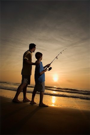 silhouette father and son sunset - Father and son fishing in ocean surf at sunset.  Vertically framed shot. Stock Photo - Budget Royalty-Free & Subscription, Code: 400-04168820