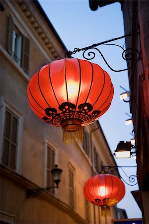 pictures of house street lighting - Low angle view of illuminated red paper lanterns hanging outside on a building facade. Vertical shot. Stock Photo - Budget Royalty-Free & Subscription, Code: 400-04168969