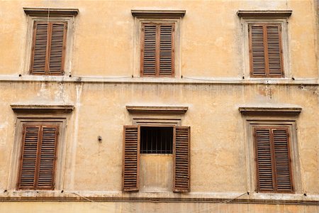 Shuttered windows in an old building, with the shutters closed on all windows but one. Horizontal shot. Stock Photo - Budget Royalty-Free & Subscription, Code: 400-04168961