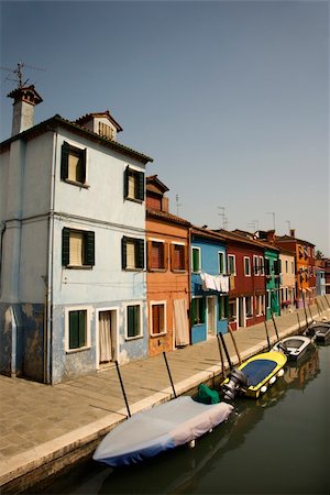 Buildings and boats on a canal in Venice, Italy, under blue sky. Vertical shot. Stock Photo - Budget Royalty-Free & Subscription, Code: 400-04168993