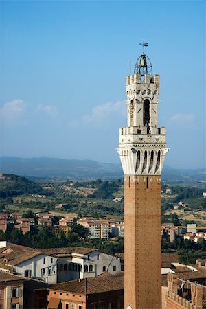 palazzo publico - Bell tower of the Palazzo Pubblico, and surrounding buildings, in Siena, Italy. Vertical shot. Photographie de stock - Aubaine LD & Abonnement, Code: 400-04169015