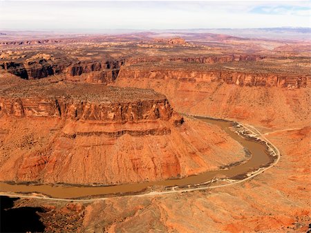 simsearch:400-03948680,k - Aerial view of an arid, craggy landscape with a river running through it. Horizontal shot. Foto de stock - Super Valor sin royalties y Suscripción, Código: 400-04169685