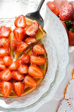 simsearch:400-07042820,k - Cheesecake with sliced fresh strawberries on plate Stock Photo - Budget Royalty-Free & Subscription, Code: 400-04169716