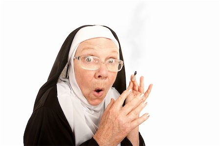 Funny nun suprirsed holding a lit cigarette Stock Photo - Budget Royalty-Free & Subscription, Code: 400-04169928