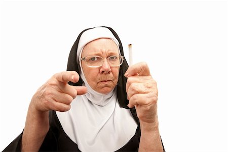 disappointed teacher - Stern nun reprimanding over a discovered cigarette Stock Photo - Budget Royalty-Free & Subscription, Code: 400-04169929