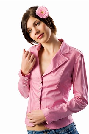 simsearch:400-04667271,k - nice brunette in pink jacket with a pink gerbera in her hair looking in camera Stock Photo - Budget Royalty-Free & Subscription, Code: 400-04160344