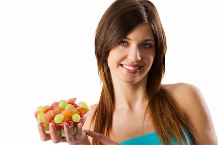 happy smiling young and pretty brunette with a cup of fresh salad fruit Stock Photo - Budget Royalty-Free & Subscription, Code: 400-04160347