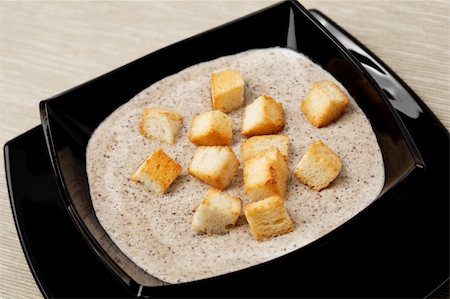 soup and crackers - Mushroom cream soup with pieces of toasted bread. Stock Photo - Budget Royalty-Free & Subscription, Code: 400-04161294