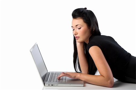 beautiful young oriental woman using a laptop laying down on the floor Stock Photo - Budget Royalty-Free & Subscription, Code: 400-04161482