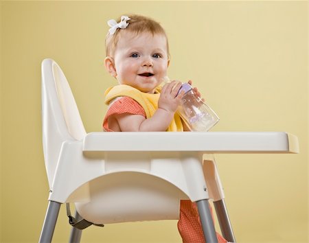 Baby girl in high chair smiling.  Vertically framed shot. Stock Photo - Budget Royalty-Free & Subscription, Code: 400-04161963