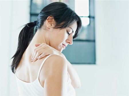 simsearch:695-05769616,k - woman massaging neck. Side view, copy space Stock Photo - Budget Royalty-Free & Subscription, Code: 400-04162196