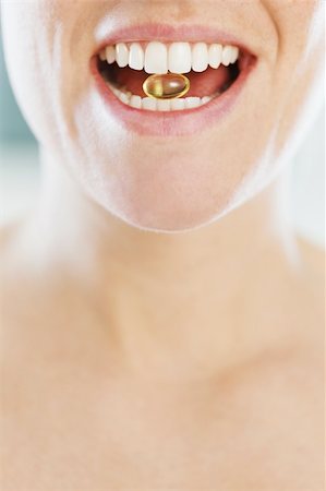 simsearch:649-07559812,k - closeup of woman eating pill. Copy space Stock Photo - Budget Royalty-Free & Subscription, Code: 400-04162841