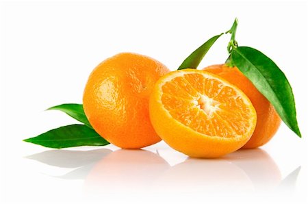 simsearch:400-04164071,k - fresh tangerine fruits with cut and green leaves isolated on white background Stock Photo - Budget Royalty-Free & Subscription, Code: 400-04162865