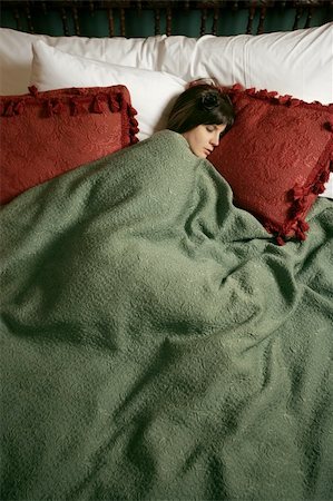 Photo of a beautiful female sleeping alone in a large bed. Stock Photo - Budget Royalty-Free & Subscription, Code: 400-04163626