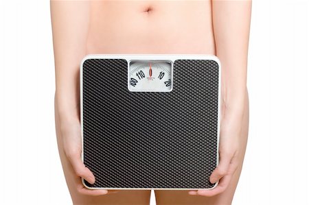 scale makeup woman - Woman holds a scale in front of her hip, showing only the belly button Foto de stock - Super Valor sin royalties y Suscripción, Código: 400-04163769