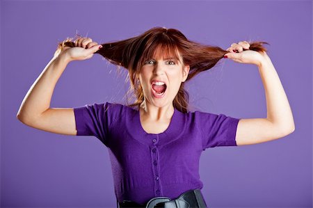 person screaming pulling hair - Beautiful woman with a angry expression pulling her hair Stock Photo - Budget Royalty-Free & Subscription, Code: 400-04174048
