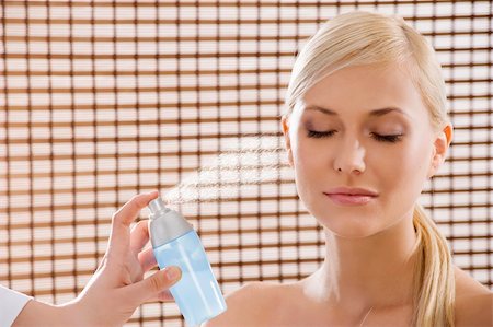 perfume industry - beauty advertising shot of a blond girl in act to be in a wellness farm with towel and cosmetic product Stock Photo - Budget Royalty-Free & Subscription, Code: 400-04174101