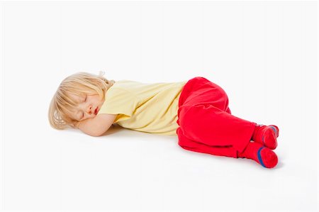 beautiful boy with long blond hair sleeping on the floor Stock Photo - Budget Royalty-Free & Subscription, Code: 400-04175038