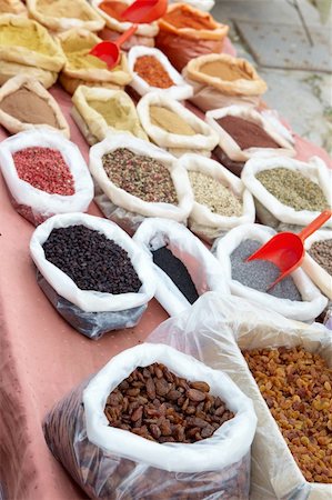 Bags of dry produce (nuts, seeds and spices) from the market as a textured food background. Shallow DOF, focus on lower third. Stock Photo - Budget Royalty-Free & Subscription, Code: 400-04175099