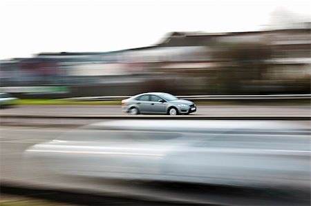 a fast paced car driving along the motorway highway Stock Photo - Budget Royalty-Free & Subscription, Code: 400-04175350