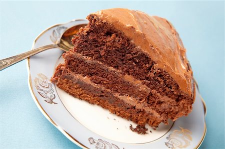 Slice of chocolate cake on antique blue plate, selective focus. Stock Photo - Budget Royalty-Free & Subscription, Code: 400-04175544