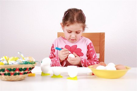 Cute little girl painting Easter eggs Stock Photo - Budget Royalty-Free & Subscription, Code: 400-04176150