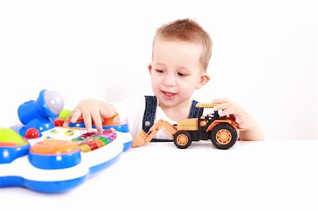 simsearch:400-04161658,k - Portrait of lovely boy playing with toys with copy space Fotografie stock - Microstock e Abbonamento, Codice: 400-04176665