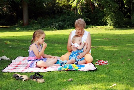 Kids have a small picnic with grandma Stock Photo - Budget Royalty-Free & Subscription, Code: 400-04176661