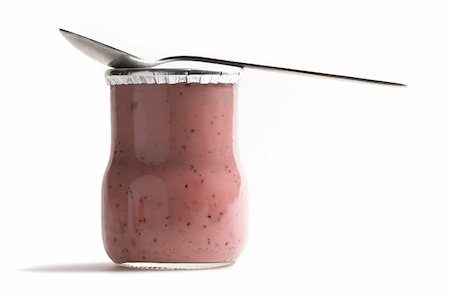 Strawberry yoghurt jar with a tea spoon on it. Stock Photo - Budget Royalty-Free & Subscription, Code: 400-04176745